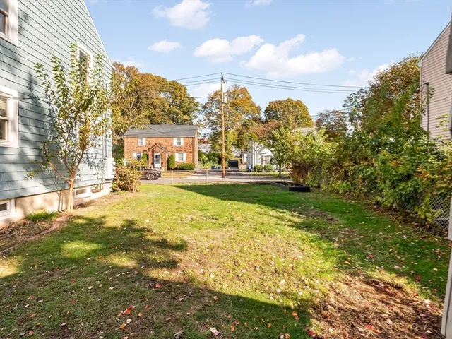 a front view of house with yard and swimming pool
