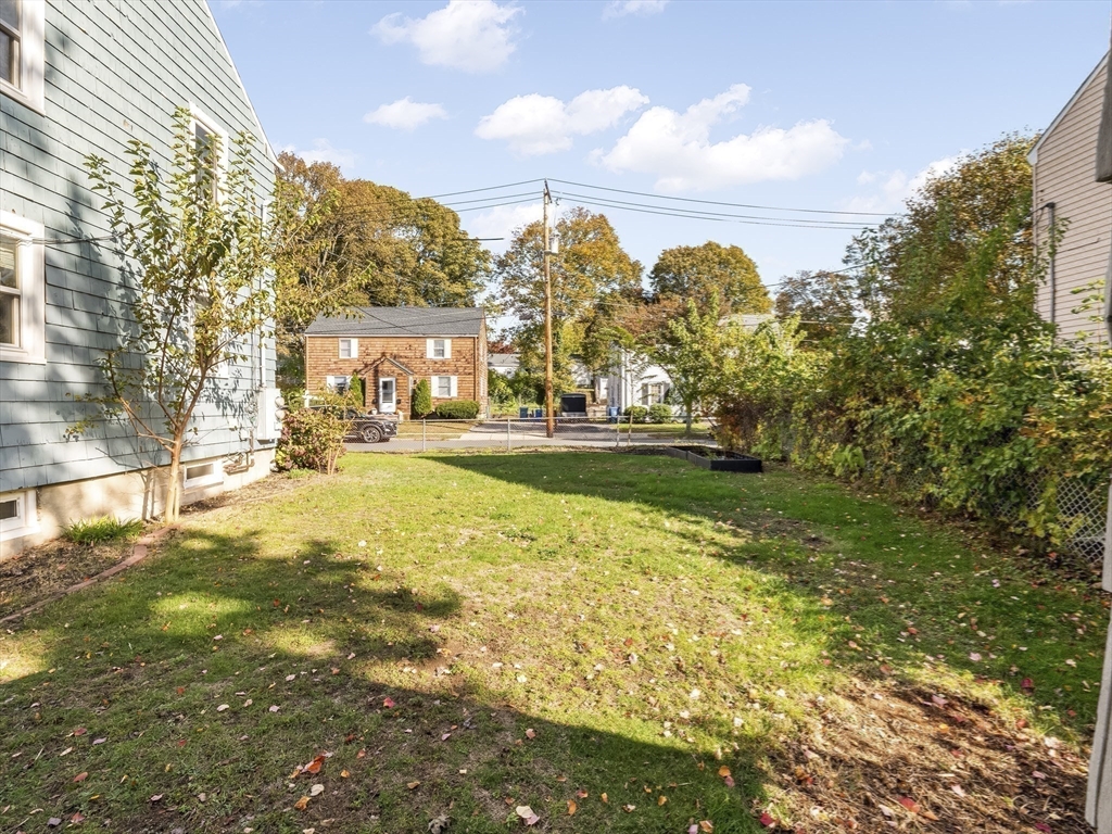 22 Jefferson Road, Unit 22 Wakefield, MA 01880 - Photo 20 of 22 a view of yard with swimming pool and green space