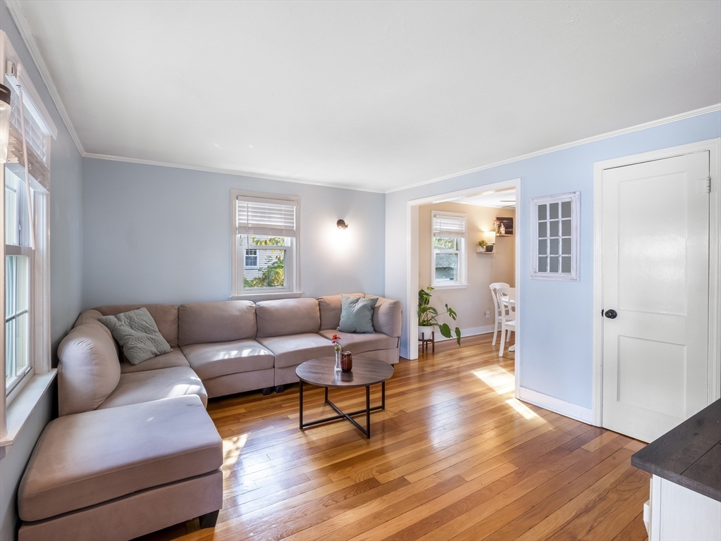 22 Jefferson Road, Unit 22 Wakefield, MA 01880 - Photo 2 of 22 a living room with furniture and a wooden floor