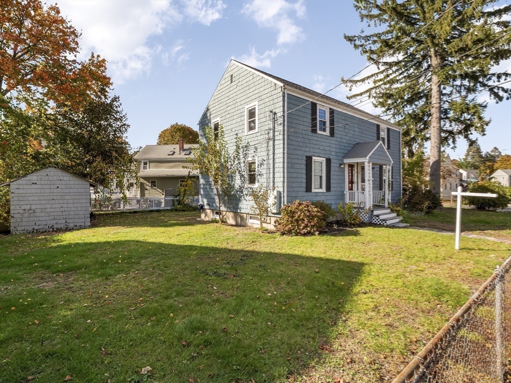 22 Jefferson Road, Unit 22 Wakefield, MA 01880 - Photo 21 of 22 a front view of house with yard and swimming pool