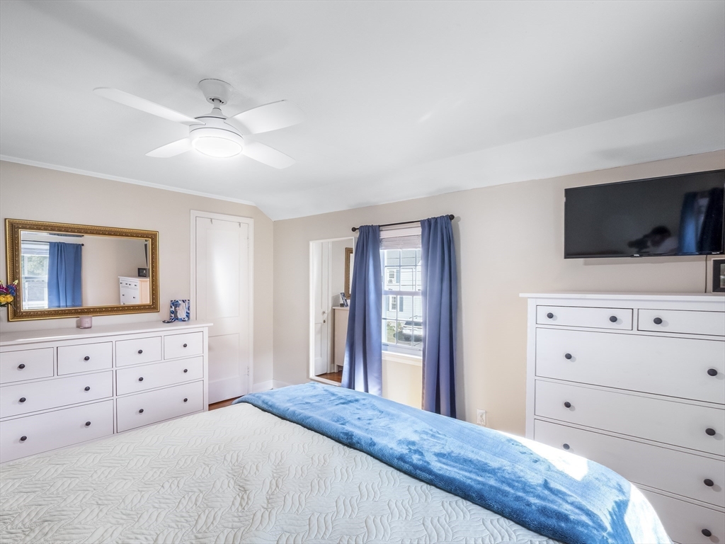 22 Jefferson Road, Unit 22 Wakefield, MA 01880 - Photo 10 of 22 a bedroom with a bed and a flat screen tv in the dresser