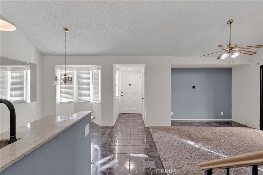 11659 Pepper Lane Apple Valley, CA 92308 - Photo 14 of 50 a view of a kitchen with a sink and cabinets