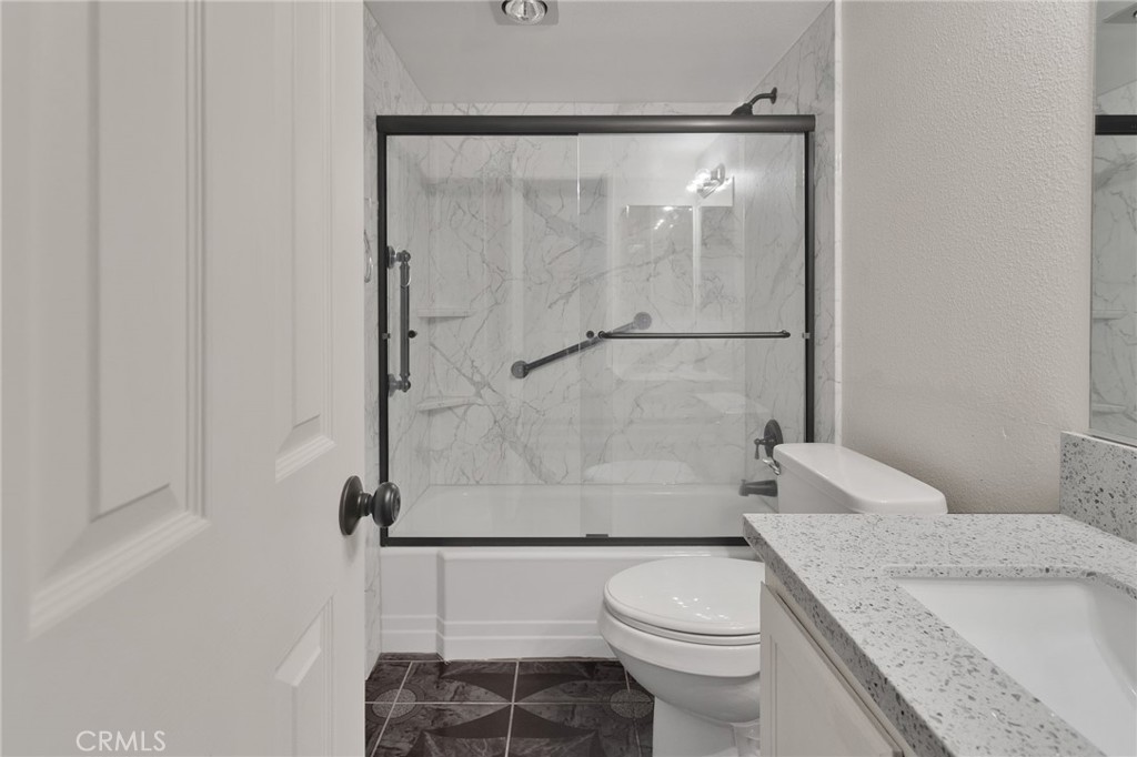 11659 Pepper Lane Apple Valley, CA 92308 - Photo 16 of 50 a white toilet sitting next to a bath tub