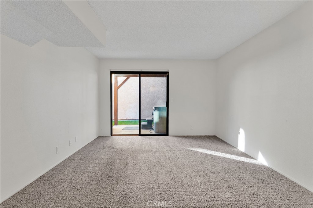11659 Pepper Lane Apple Valley, CA 92308 - Photo 21 of 50 wooden floor in an empty room with a window