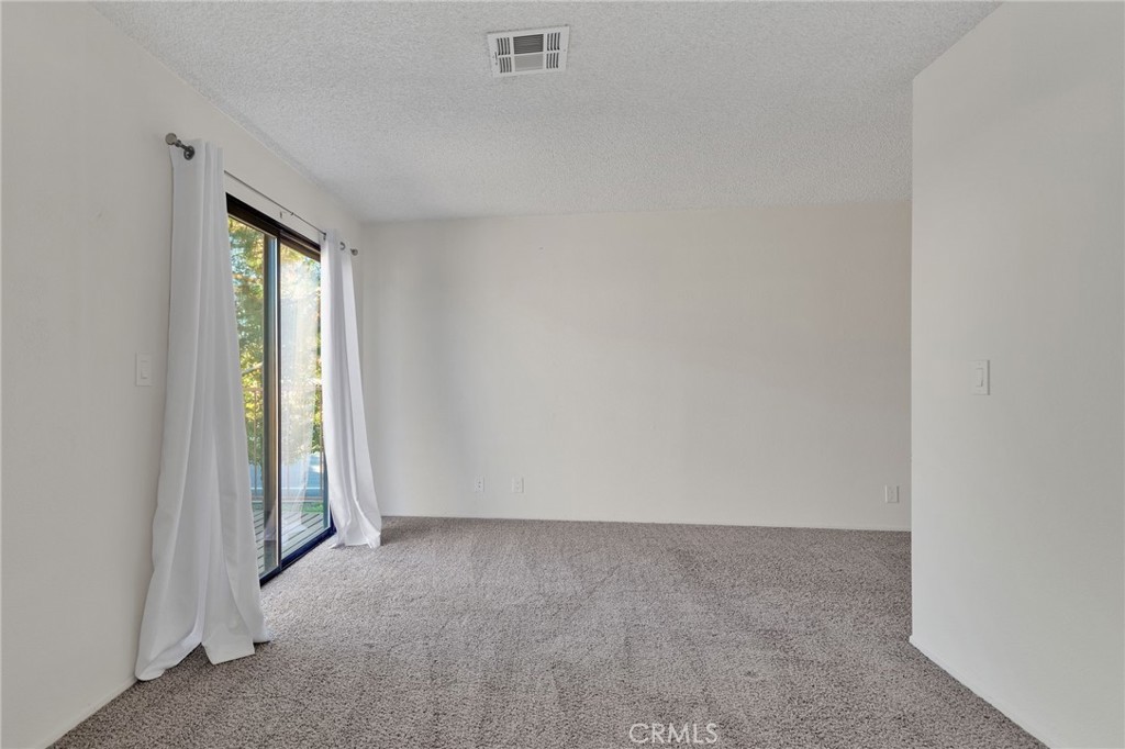11659 Pepper Lane Apple Valley, CA 92308 - Photo 29 of 50 a view of an empty room and window