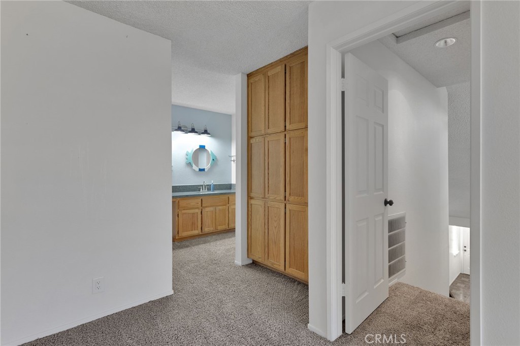11659 Pepper Lane Apple Valley, CA 92308 - Photo 30 of 50 a view of hallway with bathroom