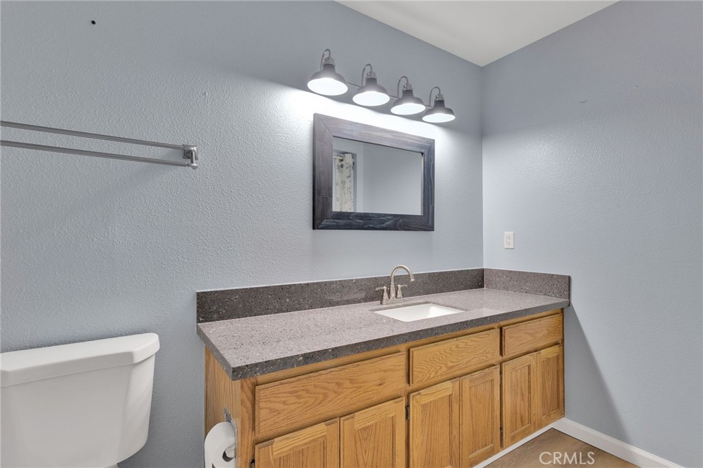 11659 Pepper Lane Apple Valley, CA 92308 - Photo 32 of 50 a bathroom with a sink vanity granite and toilet