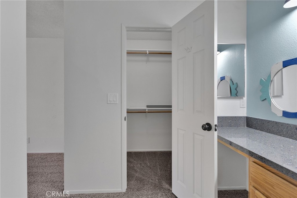 11659 Pepper Lane Apple Valley, CA 92308 - Photo 35 of 50 a bathroom with a granite countertop sink