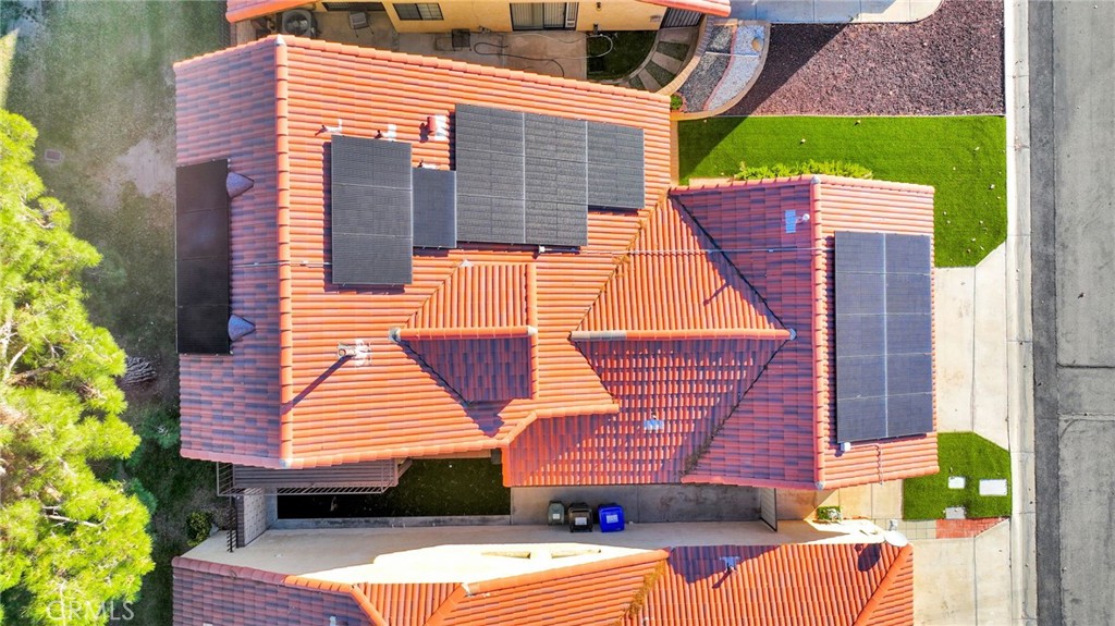 11659 Pepper Lane Apple Valley, CA 92308 - Photo 48 of 50 a view of a patio with couches chairs potted plants and wooden floor