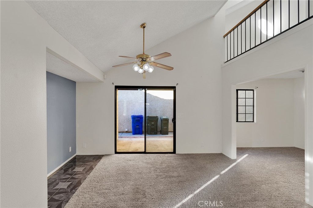 11659 Pepper Lane Apple Valley, CA 92308 - Photo 7 of 50 a view of an empty room with a chandelier fan