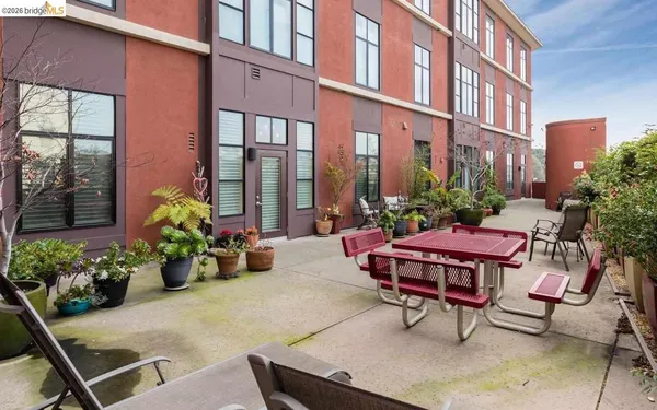 a view of a backyard with sitting area