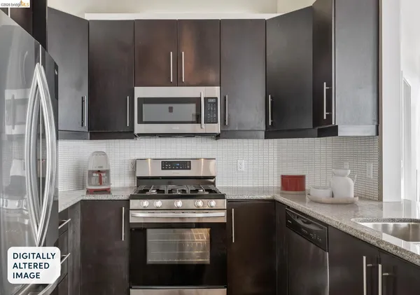 a kitchen with a sink stove and microwave