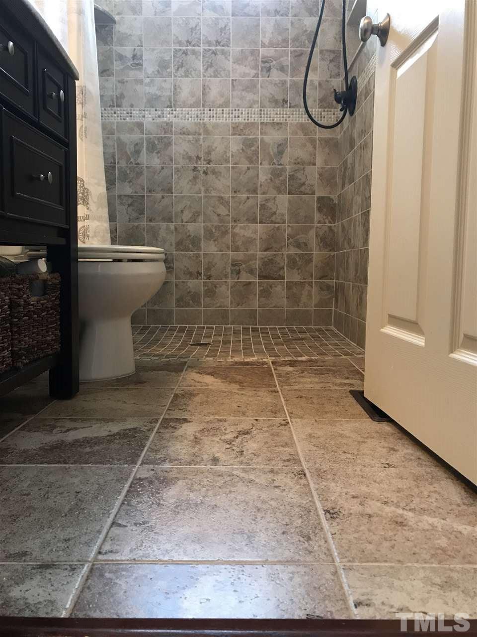225 Cooke Street Raleigh, NC 27601 - Photo 11 of 24 a bathroom with a shower