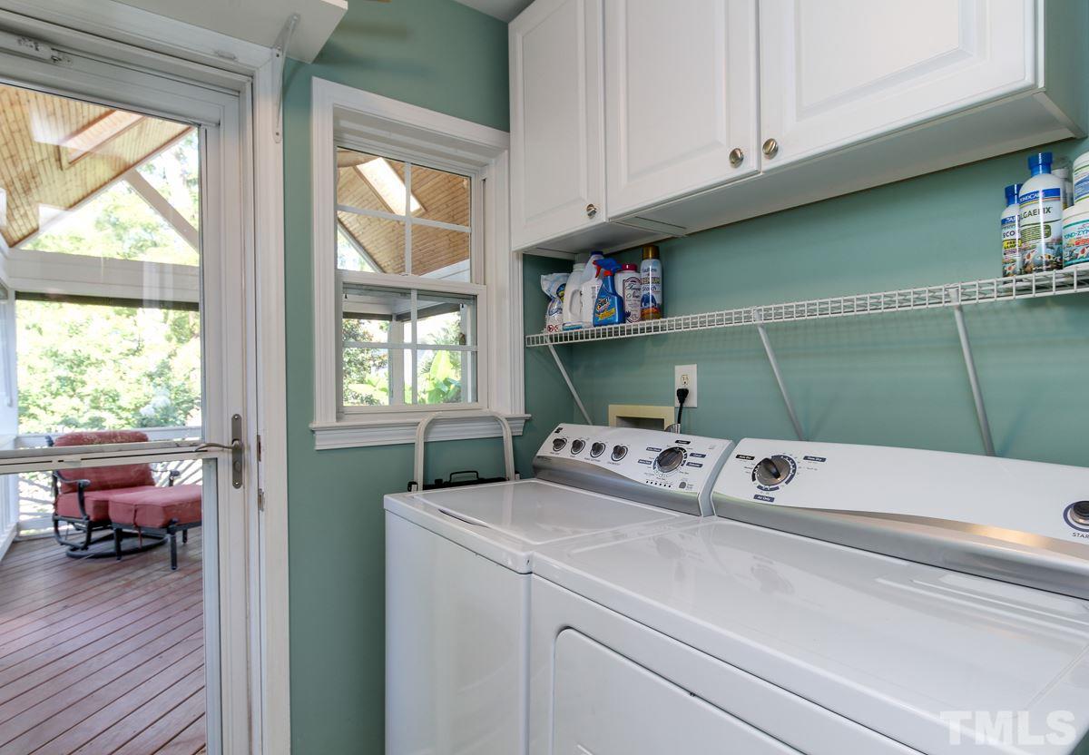 225 Cooke Street Raleigh, NC 27601 - Photo 12 of 24 a kitchen with a refrigerator and a window
