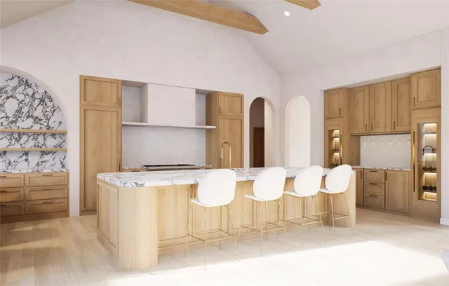 a room with a table chairs and a refrigerator