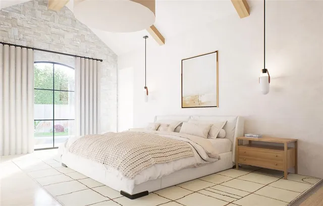 a bedroom with a bed and a large window