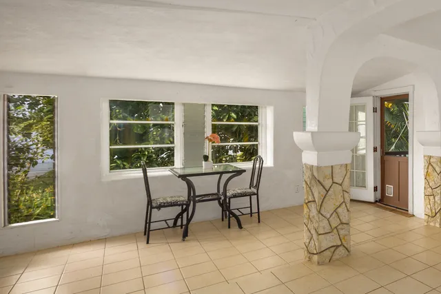 a view of a livingroom with furniture and a window
