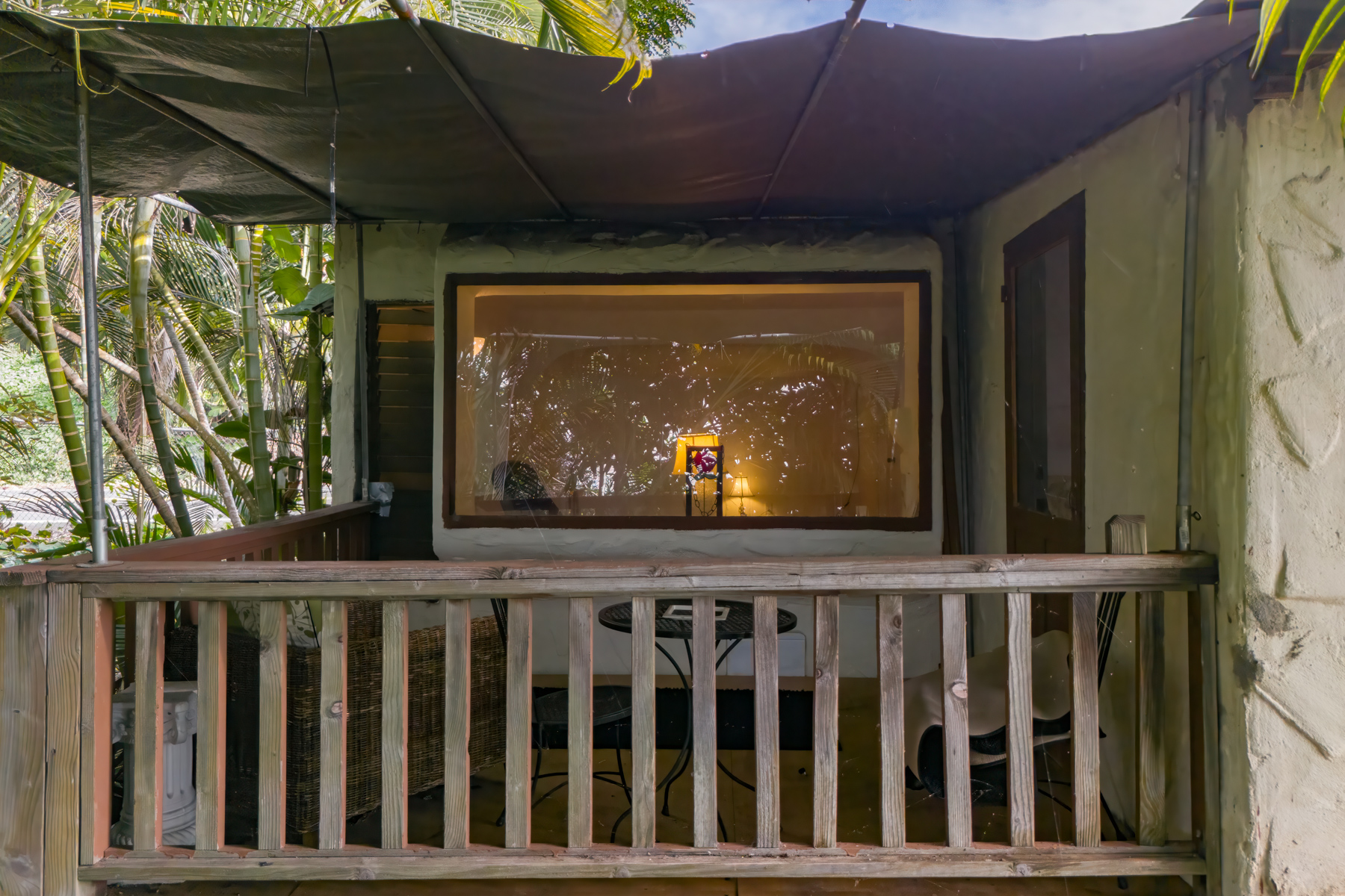 84-5125 Hawaiʻi Belt Road Captain Cook, HI 96704 - Photo 22 of 27 a wooden bench sitting in front of a house
