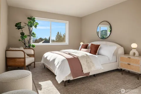 a bedroom with a bed and window