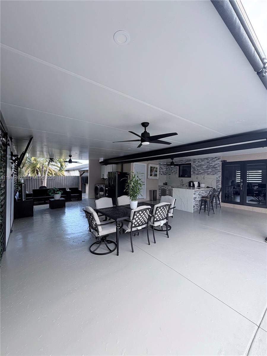 13261 Southwest 260th Terrace Homestead, FL 33032 - Photo 11 of 36 a living room with furniture and a table