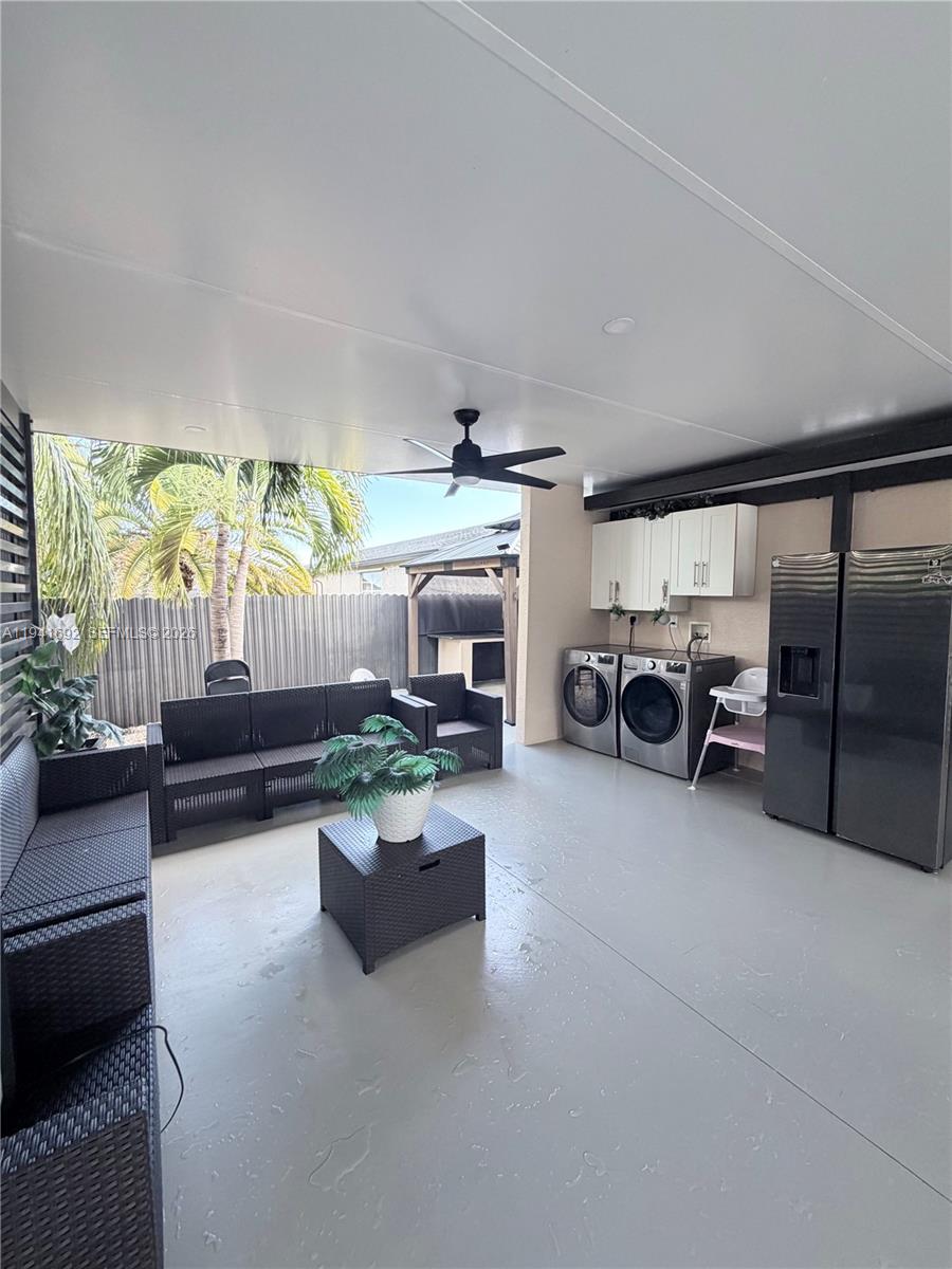 13261 Southwest 260th Terrace Homestead, FL 33032 - Photo 15 of 36 a living room with furniture fireplace and a large window