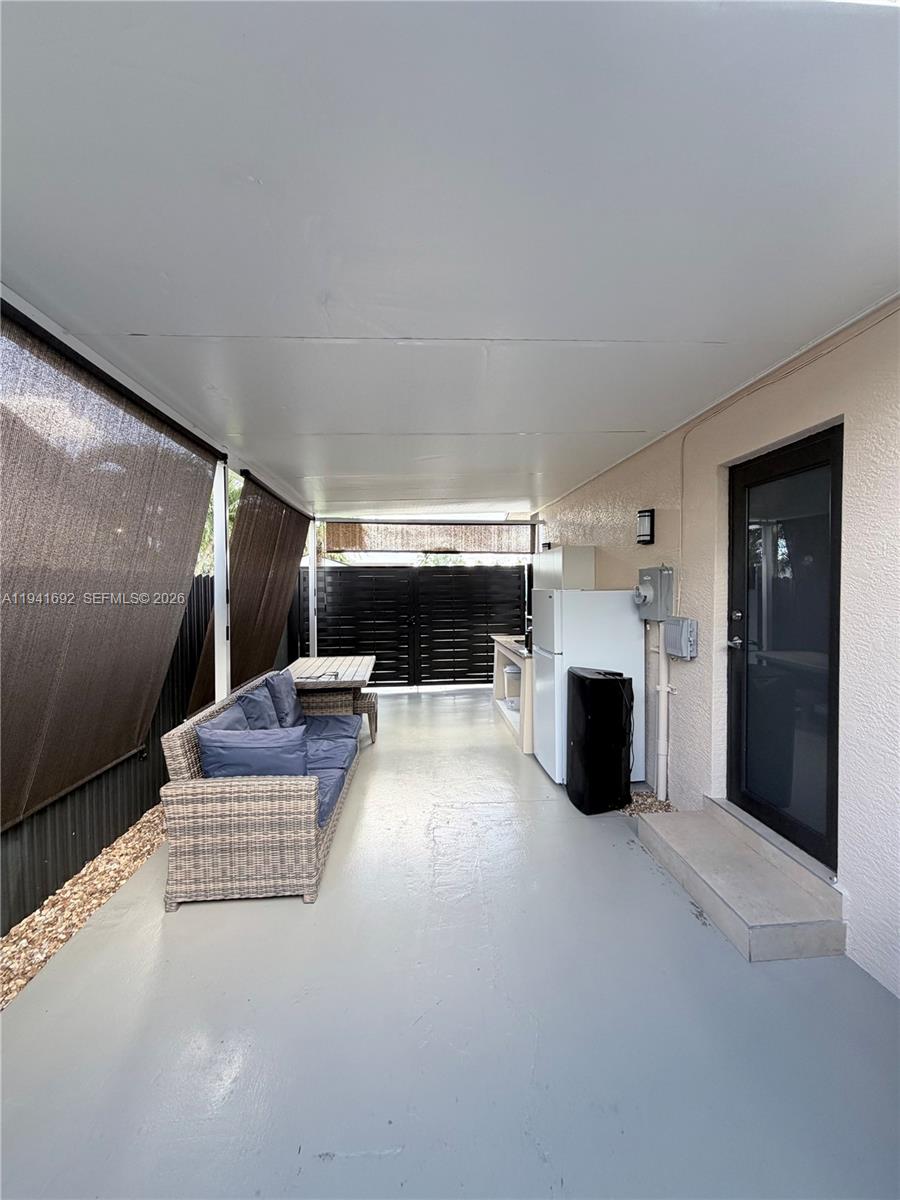 13261 Southwest 260th Terrace Homestead, FL 33032 - Photo 16 of 36 a living room with furniture and a fireplace