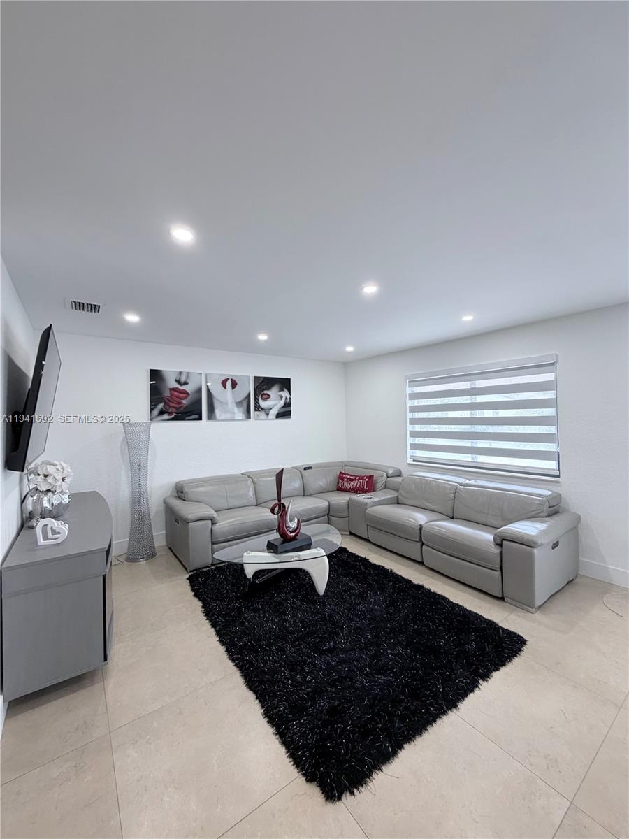 13261 Southwest 260th Terrace Homestead, FL 33032 - Photo 25 of 36 a living room with furniture and a large window