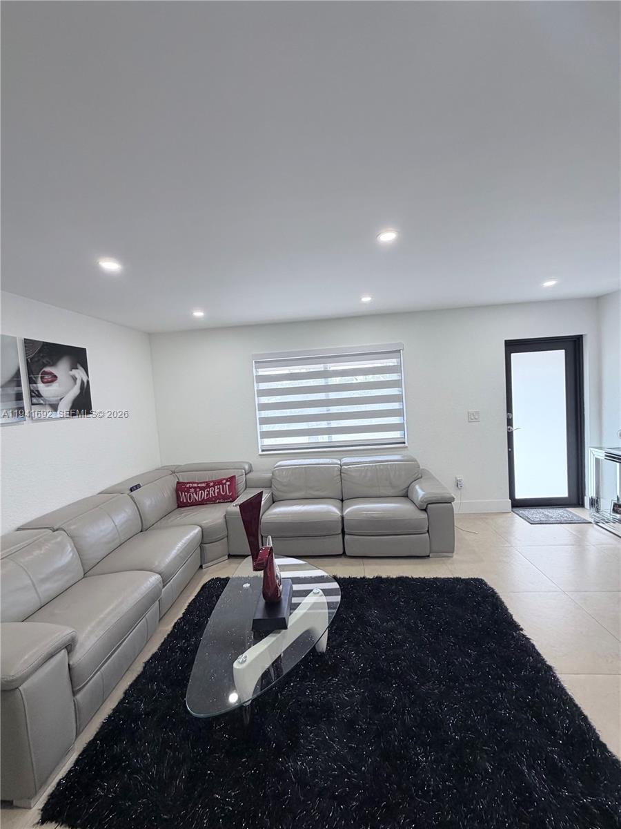 13261 Southwest 260th Terrace Homestead, FL 33032 - Photo 26 of 36 a living room with furniture and a couch