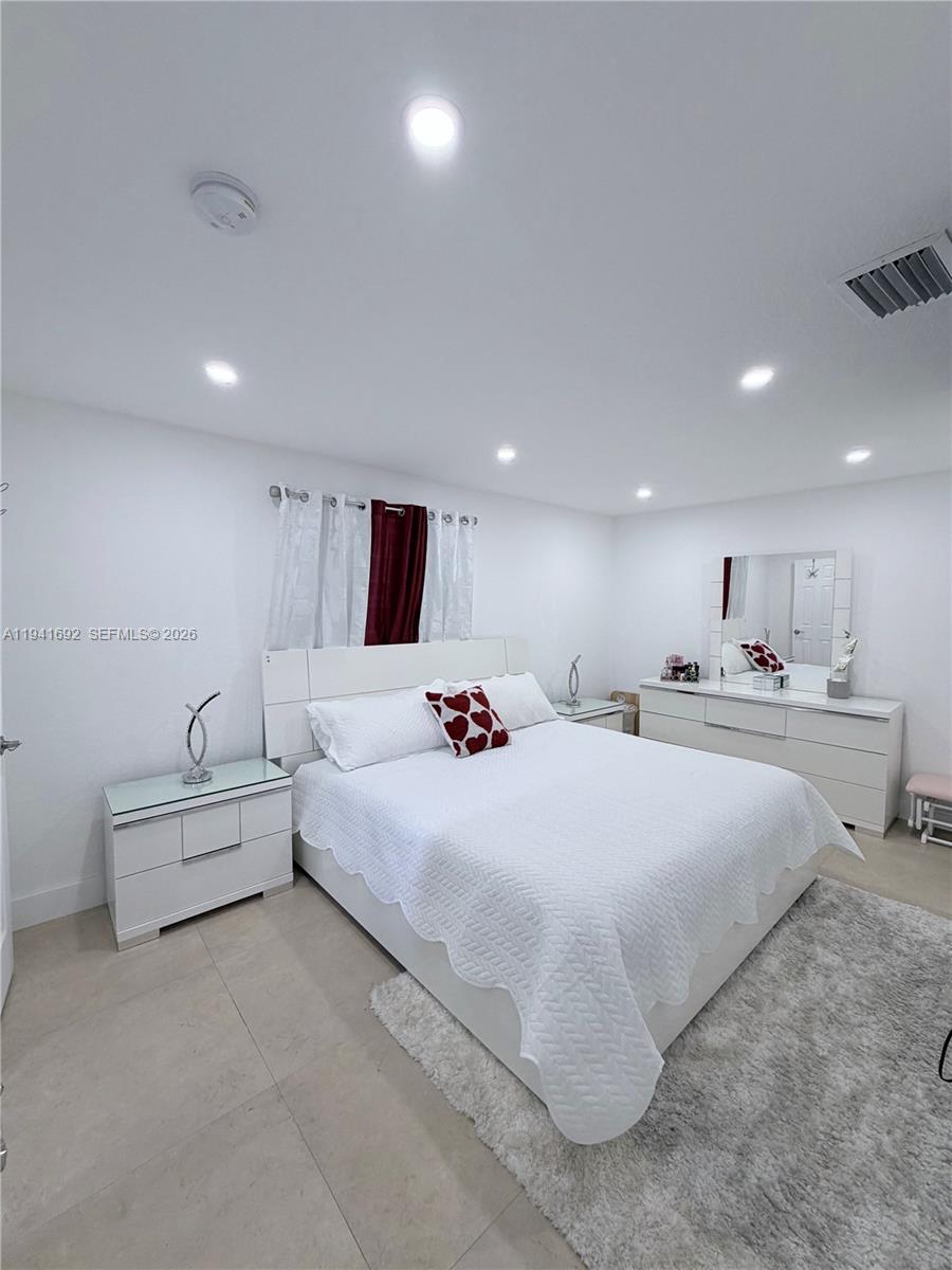 13261 Southwest 260th Terrace Homestead, FL 33032 - Photo 32 of 36 a large white bed in a white room