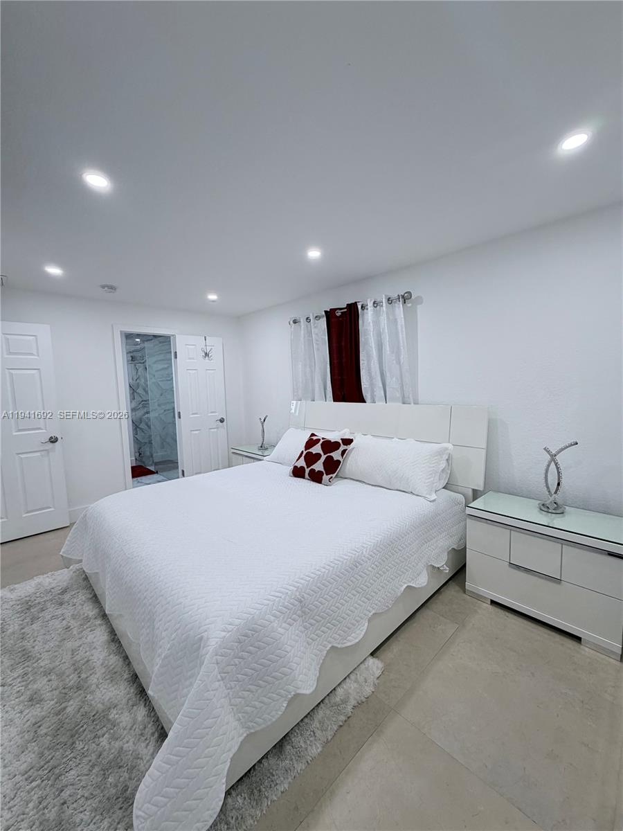 13261 Southwest 260th Terrace Homestead, FL 33032 - Photo 33 of 36 a large white bed in a white room