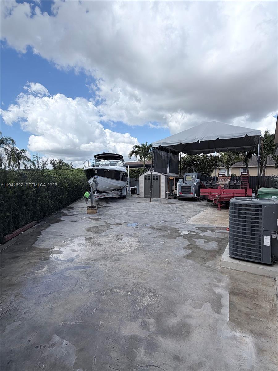 13261 Southwest 260th Terrace Homestead, FL 33032 - Photo 7 of 36 an outdoor view with patio