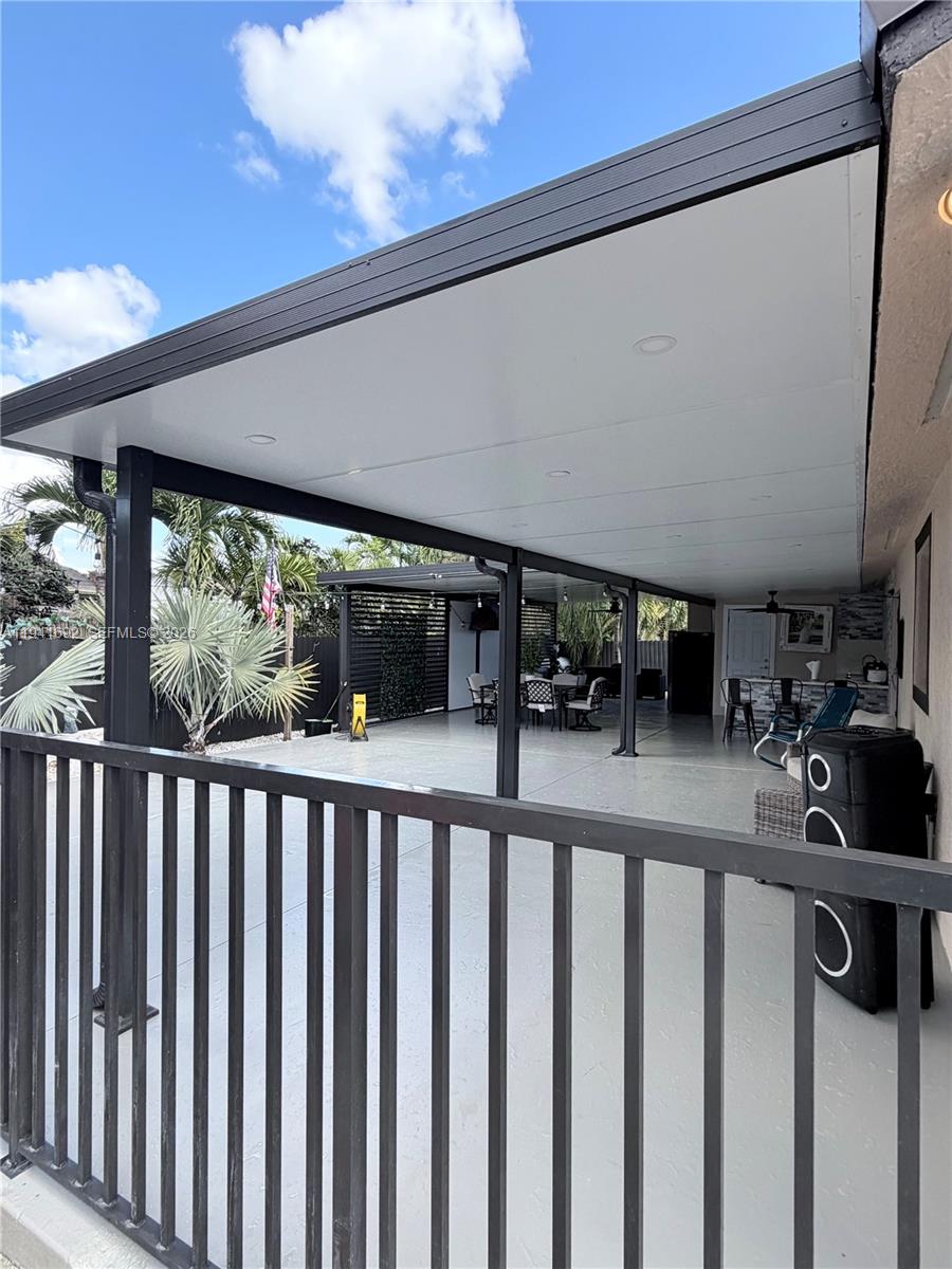 13261 Southwest 260th Terrace Homestead, FL 33032 - Photo 8 of 36 a view of a porch