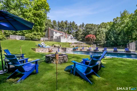 a view of a chairs and table in the garden