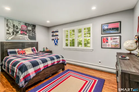 a bedroom with bed and a window