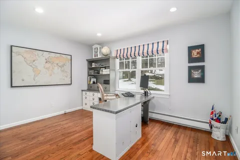 a room with wooden floor and window