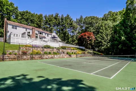 a view of a swimming pool with a yard