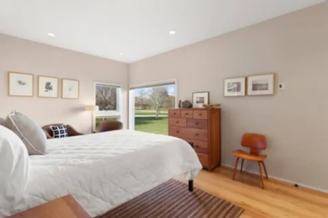 a bedroom with a bed and a cabinets