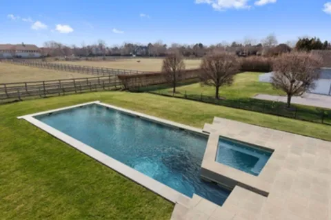 a view of a lake with houses in the back
