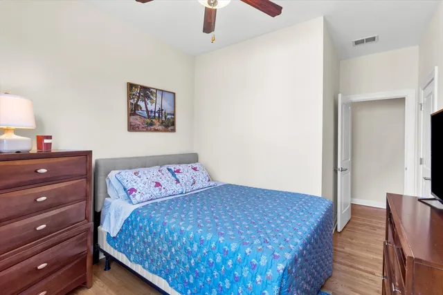 a bedroom with a bed and a dresser