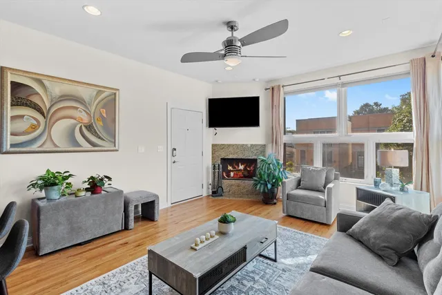 a living room with furniture fireplace and a flat screen tv