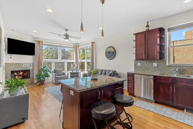 a kitchen with a sink stove and microwave