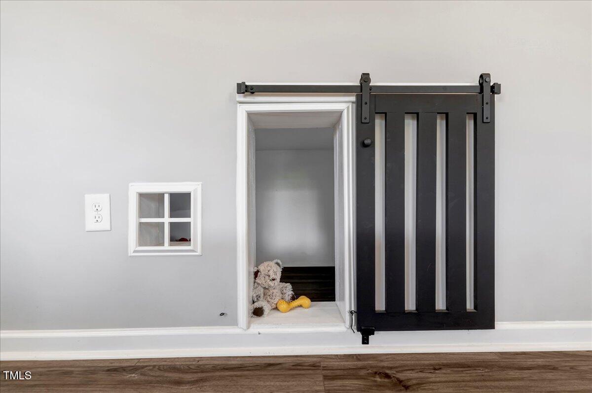 45 Iris Drive Youngsville, NC 27596 - Photo 11 of 35 a view of a livingroom with wooden floor and a fireplace