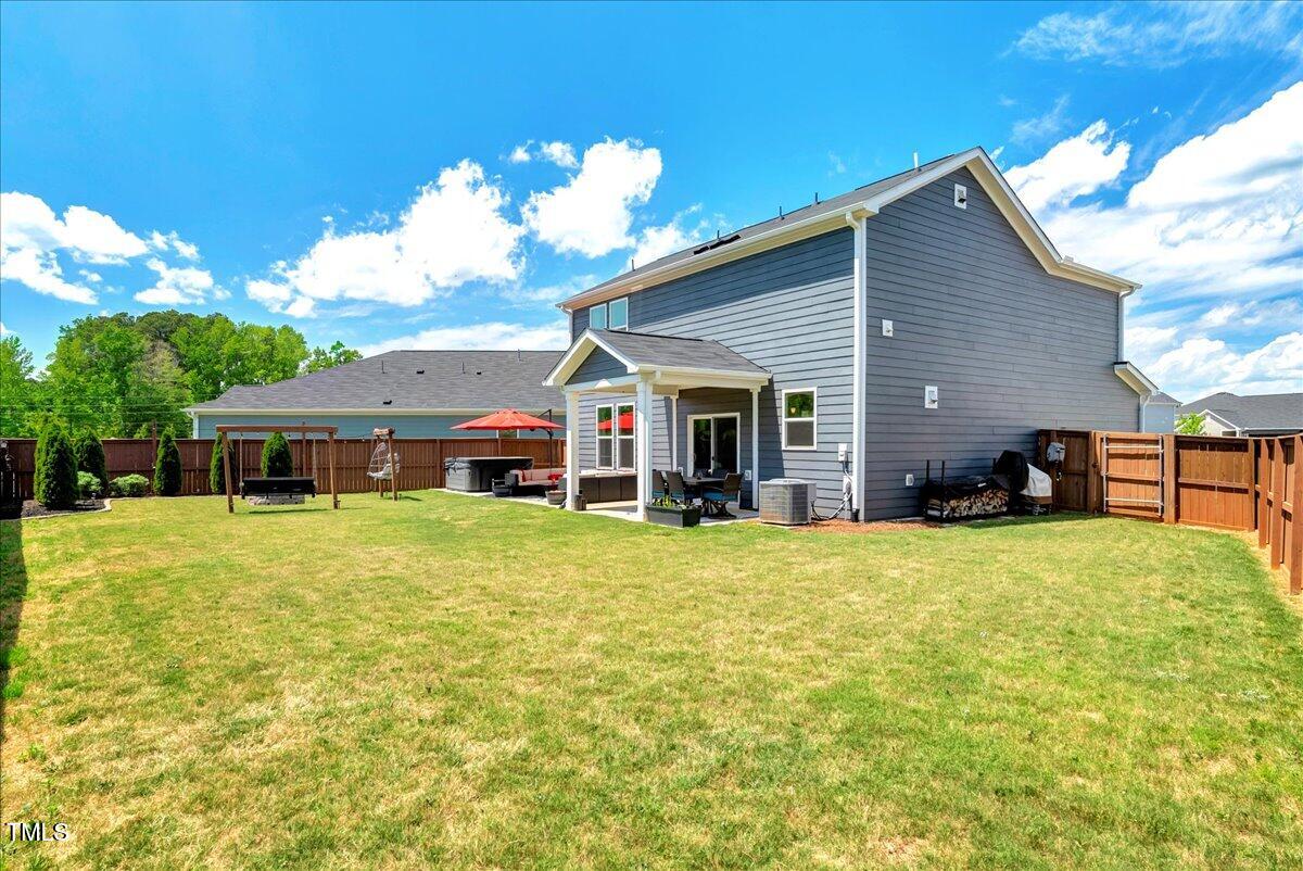 45 Iris Drive Youngsville, NC 27596 - Photo 23 of 35 a front view of house with yard and seating area