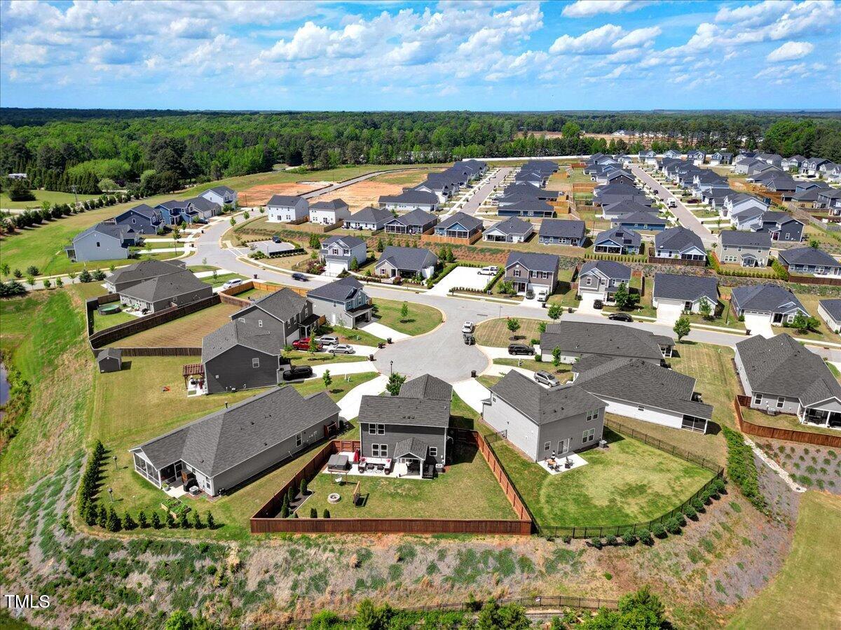 45 Iris Drive Youngsville, NC 27596 - Photo 25 of 35 an aerial view of a house with a garden