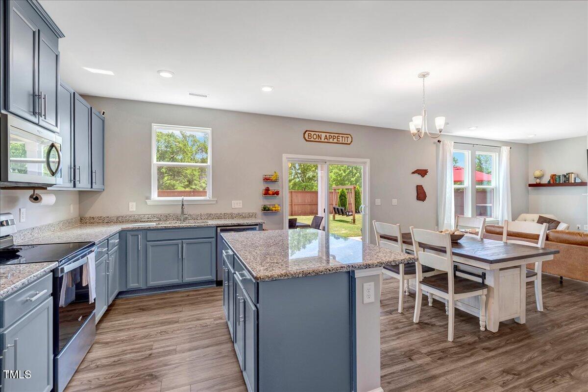 45 Iris Drive Youngsville, NC 27596 - Photo 3 of 35 a kitchen with granite countertop lots of counter top space and dining table