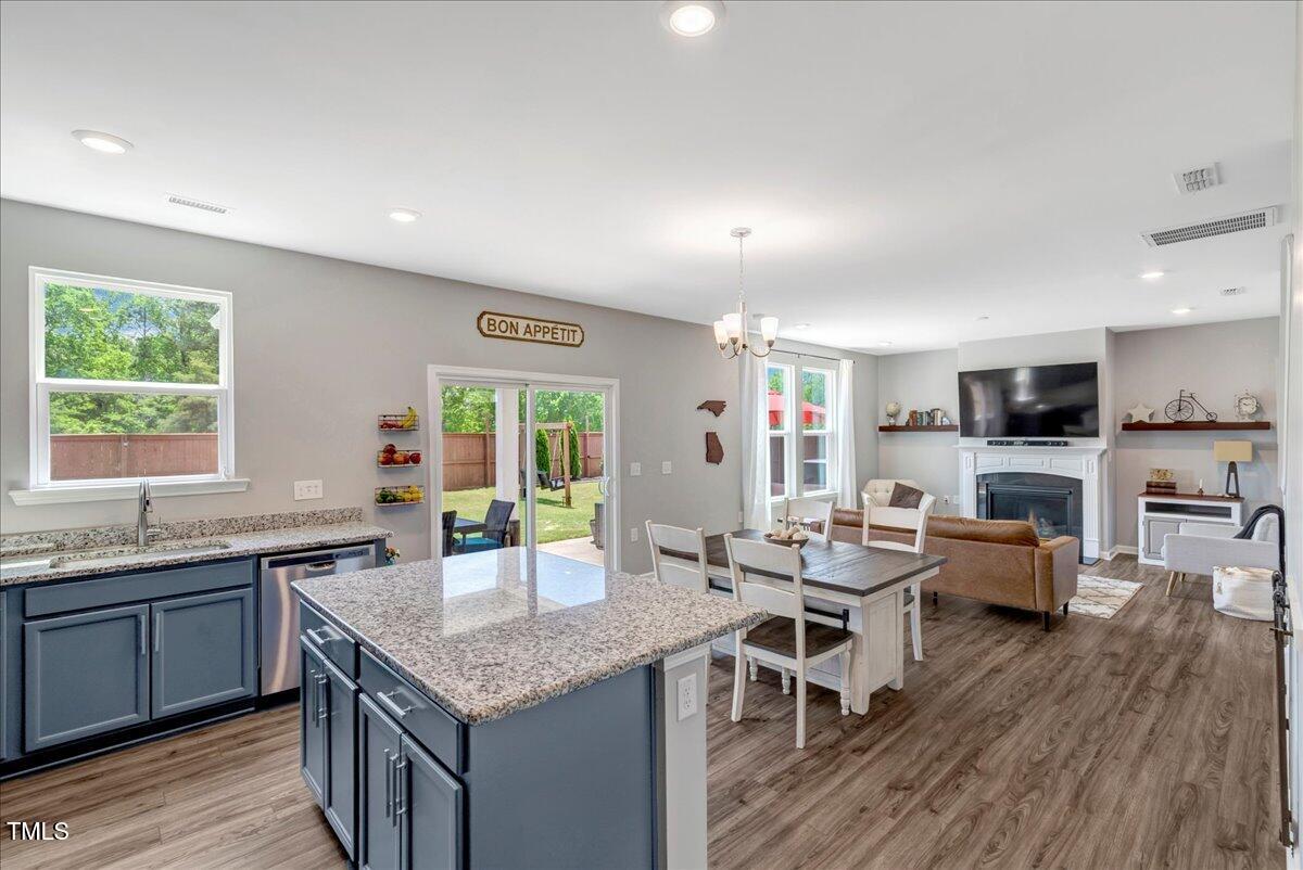45 Iris Drive Youngsville, NC 27596 - Photo 4 of 35 a kitchen with granite countertop lots of counter top space and living room