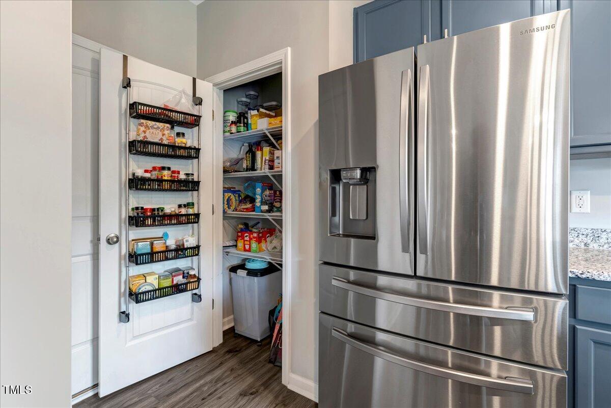 45 Iris Drive Youngsville, NC 27596 - Photo 7 of 35 a room with refrigerator and cabinets