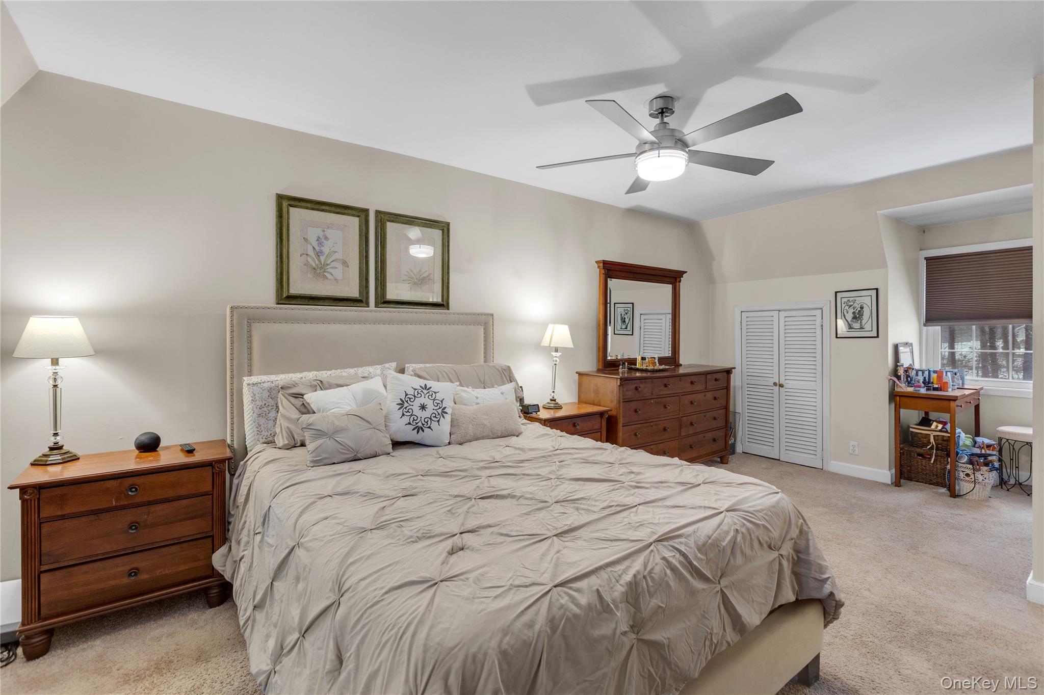 72 Daly Road East Northport, NY 11731 - Photo 11 of 18 a bedroom with a bed and a chandelier