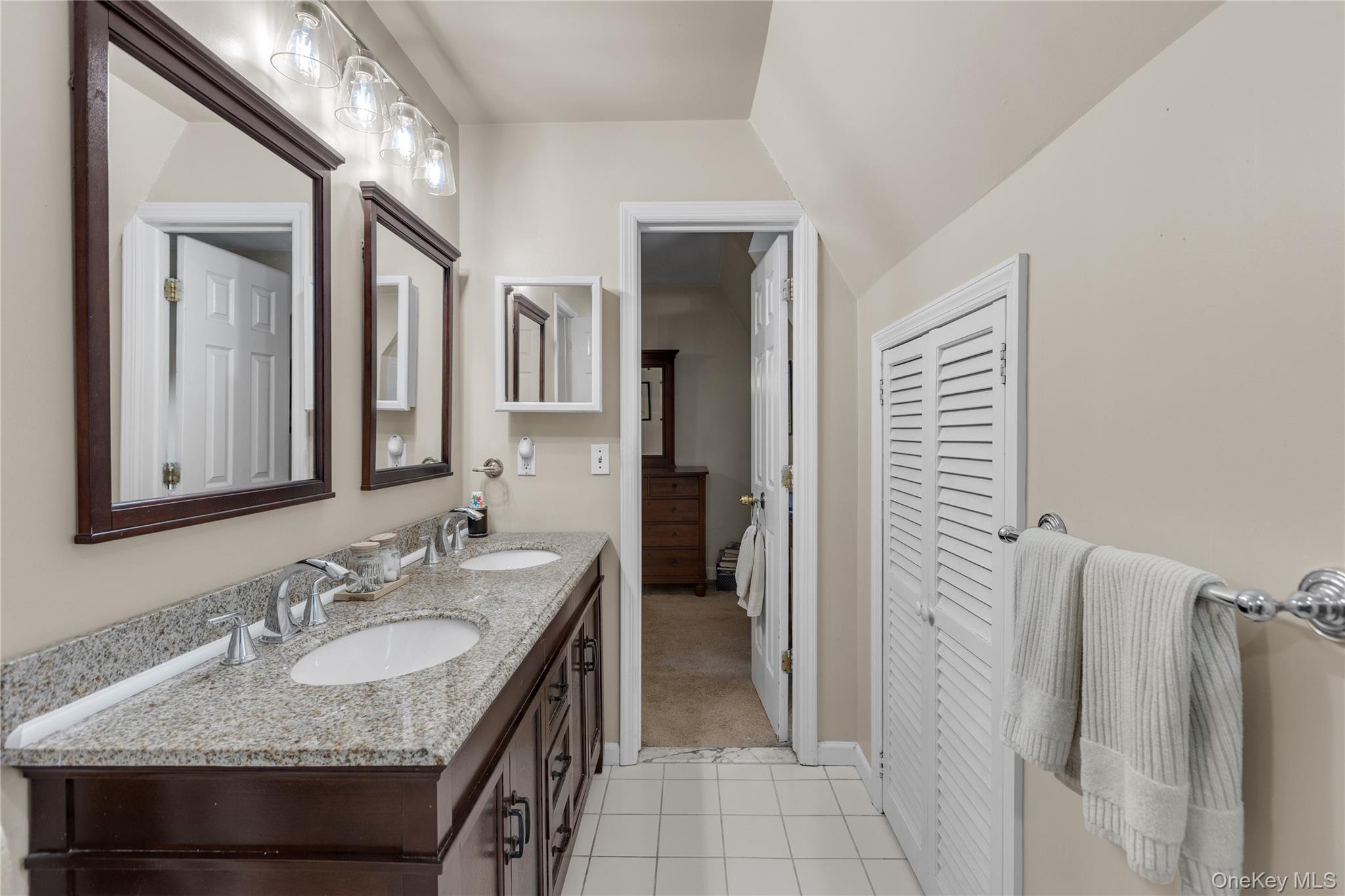 72 Daly Road East Northport, NY 11731 - Photo 13 of 18 a bathroom with a granite countertop sink and a mirror