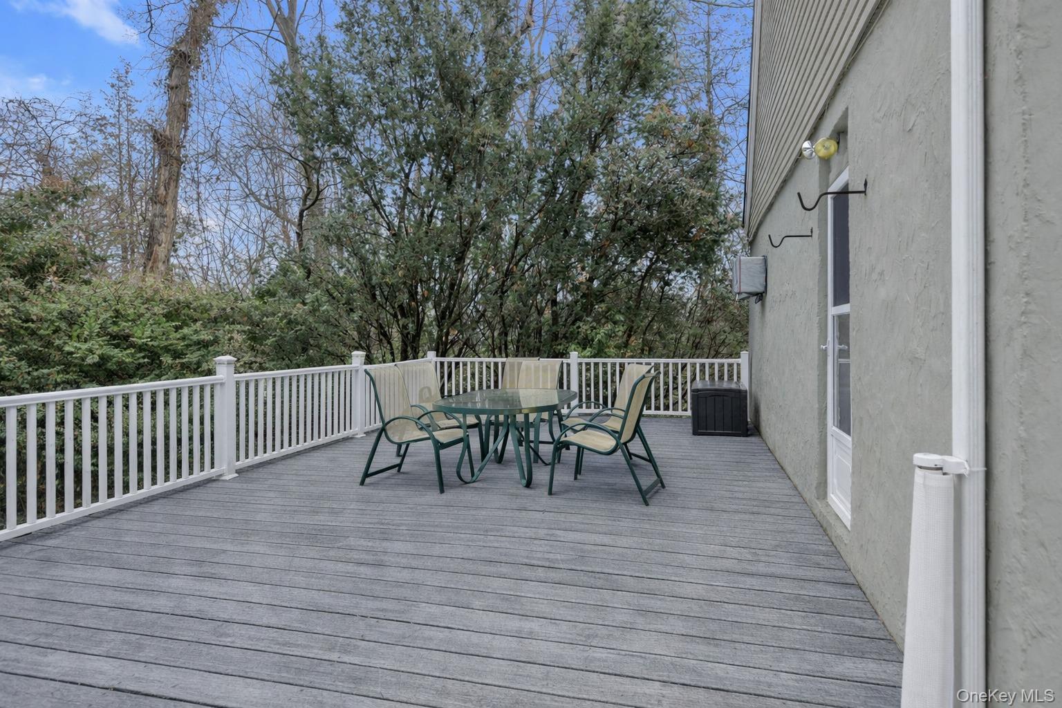 72 Daly Road East Northport, NY 11731 - Photo 15 of 18 a view of a dinning table and chairs on roof deck
